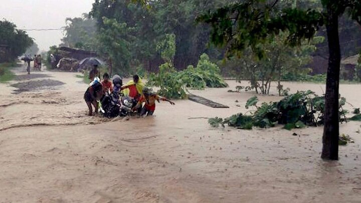 Railway stations in Kishanganj, Katihar and Jogbani in Araria were flooded by water, leaving scores of passengers stranded. Eighteen trains have been cancelled since Sunday. According to officials, crops worth crores were damaged and road link to several places had been snapped. (Photo: PTI)