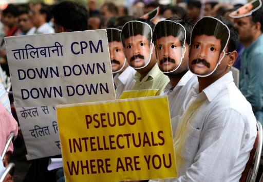 Protestors take part in a protest against the killing of Rajesh Edavakode, a worker from the Rashtriya Swayamsevak Sangh (RSS) organisation/ AFP image