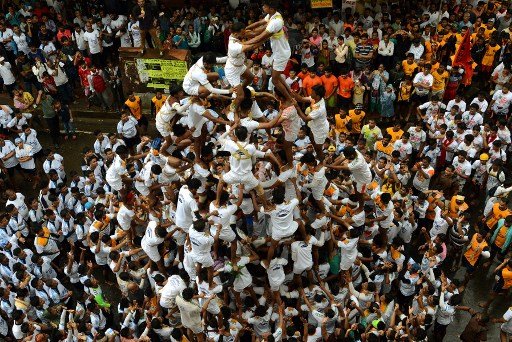 Groups of revellers -- or Govindas as they are popularly known -- went around various venues singing 