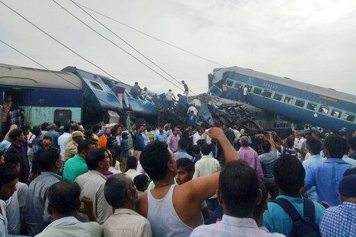 The Kalinga Utkal Express was on its way from Puri in Odisha to Haridwar in Uttarakhand when 14 coaches derailed at Khatauli. The accident was so severe that some of the derailed coaches mounted on others. (AP Photo)