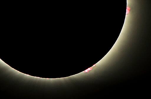 This photo shows solar flares as the sun emerges from a total eclipse by the moon, Monday, Aug. 21, 2017, in Dayton, Tenn. (Joe Songer /AL.com via AP)