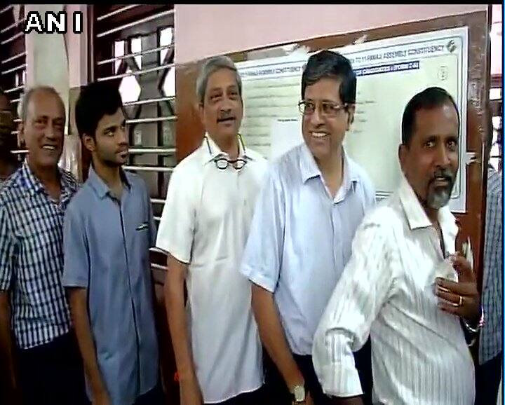 Goa Chief Minister Manohar Parrikar waits in queue to cast his vote in assembly bypoll.
