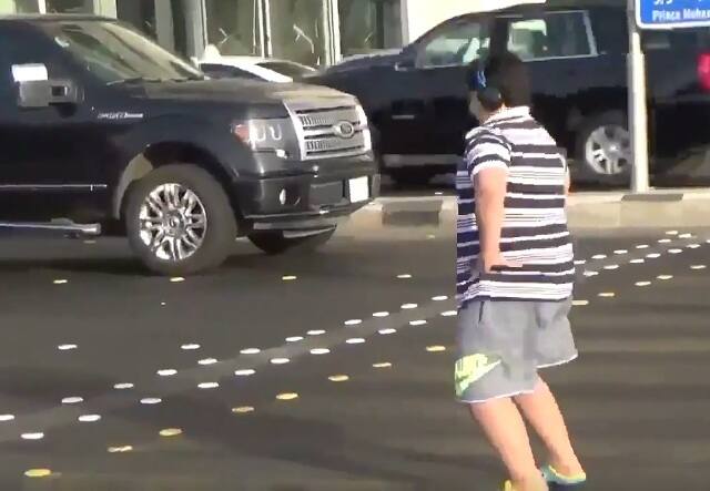 He is swaying his hips and arms to the 90s hit song 