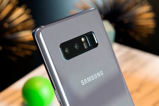 The dual cameras at the back include a 12MP wide-angle lens with an aperture of f/1.7 and a 12MP telephoto lens with aperture of f/2.4. The 8MP front camera also comes with optical image stabilisation. (AP Photo)