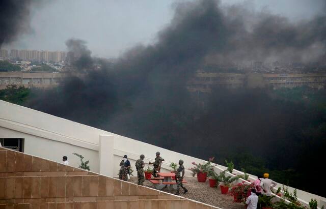 Dera Sacha Sauda chief Ram Rahim verdict: Within two hours of his conviction by a CBI court in Panchkula, the violence had left a trail of burnt vehicles, buildings and railway stations in Punjab and Haryana. Hospitals were overwhelmed with the stream of injured people being brought in. (AP Photo)