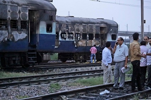 Two train coaches set ablaze, buses torched in Delhi: Police Two train coaches set ablaze, buses torched in Delhi: Police