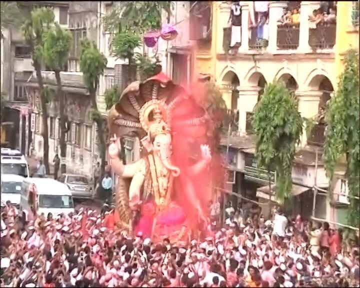 The immersion processions of Ganesha idols began Tuesday morning al lacross Mumbai. 