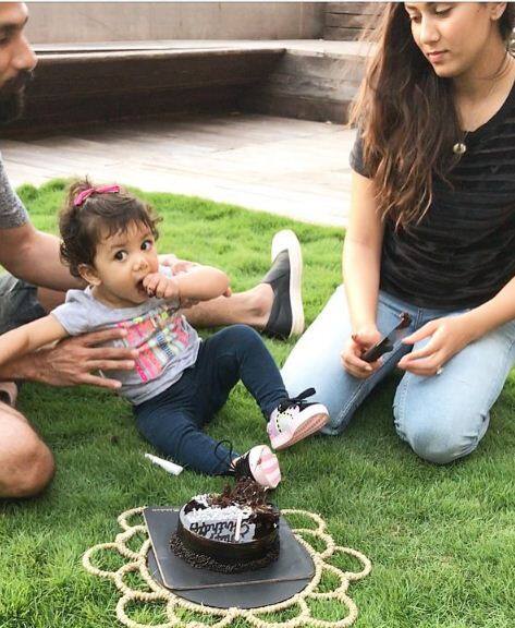 They are seen cutting Mira’s cake with their cute toddler Misha. (Image Courtesy - Instagram)