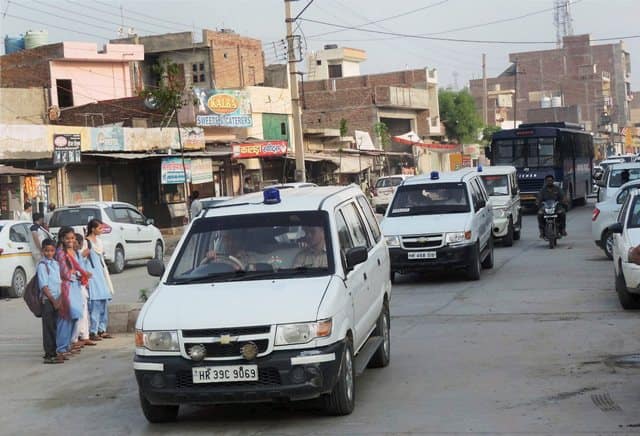 A large number of vehicles including police buses and paramilitary vehicles, Quick Reaction Team vehicles, bomb disposal squad and anti-sabotage team vehicles, carrying cops and paramilitary personnel were also involved in the search. (Photo: PTI)