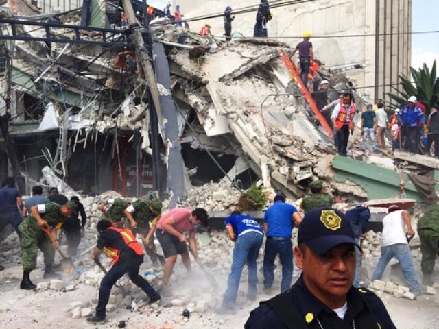 The new quake appeared to be unrelated to the magnitude 8.1 temblor that hit Sept. 7 off Mexico's southern coast and also was felt strongly in the capital. U.S. Geological Survey seismologist Paul Earle noted the epicenters of the two quakes were 400 miles (650 kilometers) apart and said most aftershocks are within (60 miles) 100 kilometers. PIC: Rescue work being undertaken. (AP).