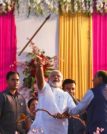 Before burning the effigy of Ravana at the Subhash Maidan opposite Red Fort in New Delhi, Prime Minister Narendra Modi advised the citizens to see festivals as source of inspiration to do something positive for society as he underlined their social relevance. ALTERNATE CROP- Indian Prime Minister Narendra Modi throws an arrow with his hand after the bow, used to symbolically shoot the arrow at a giant effigy of demon king Ravana to light it up, broke while he was trying to string it during Dussehra festival in New Delhi, India, Saturday, Sept. 30, 2017. Dussehra commemorates the triumph of Lord Rama over the demon king Ravana, marking the victory of good over evil. (AP Photo)