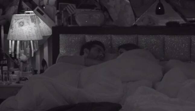 While lying in bed, Puneesh asks Bandgi to give him a kiss once(Image- Voot)