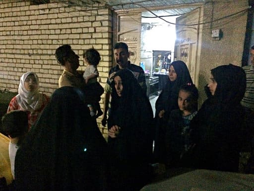 People stand in the street after feeling aftershocks from an earthquake in Baghdad, Iraq, Sunday, Nov. 12, 2017. The deadly earthquake hit the region along the border between Iran and Iraq on Sunday. The U.S. Geological Survey said the quake was centered 19 miles (31 kilometers) outside the eastern Iraqi city of Halabja. (AP Photo/Hadi Mizban)