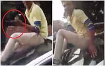 WATCH: Youth shows off pistol while sitting on car\'s hood in Allahabad