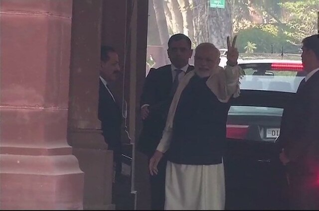 Gujarat Assembly Election Results: PM Modi flashes victory sign outside parliament Gujarat Assembly Election Results: