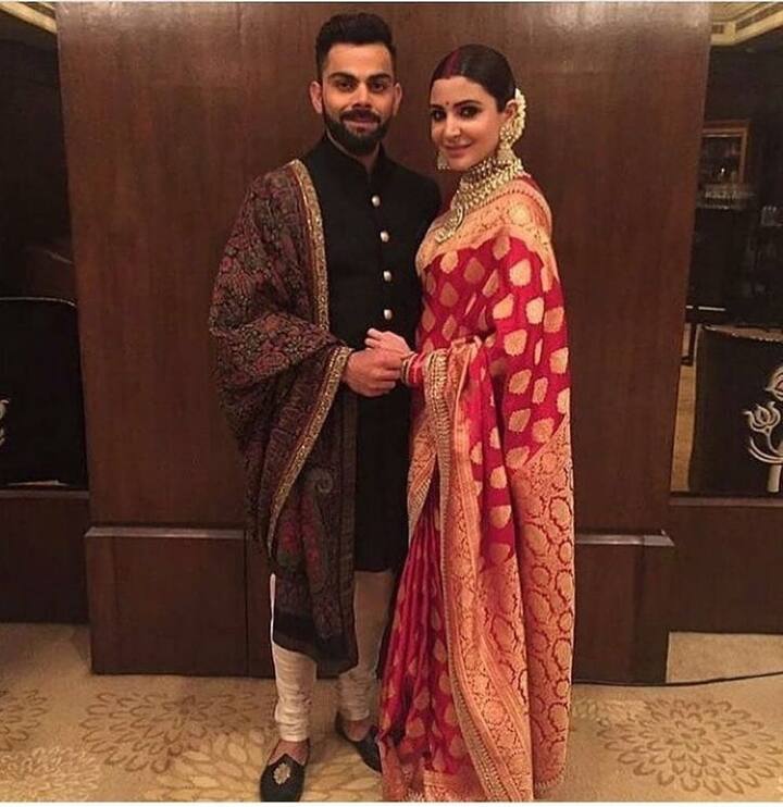 The Indian captain looked dapper in a blue Achkan and a Jamdani shawl while Bollywood beauty Anushka dazzled in a red and golden saree.