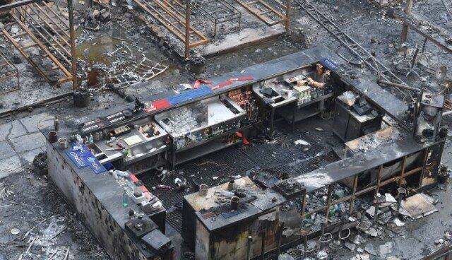 A burned bar counter is seen among the charred remains of a restobar where a rooftop party was being held in Mumbai early on December 29, 2017. Photo: AFP