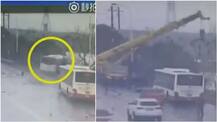 Watch: Crane driver miraculously rescues passengers after bus falls into river