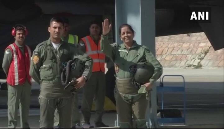 Sitharaman waves her hand before getting inside defence plane Sukhoi-30 MKI/ Courtesy: ANI