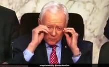 A US senator tried to remove a pair of glasses he\'s not wearing and Twitter bursts into laughter