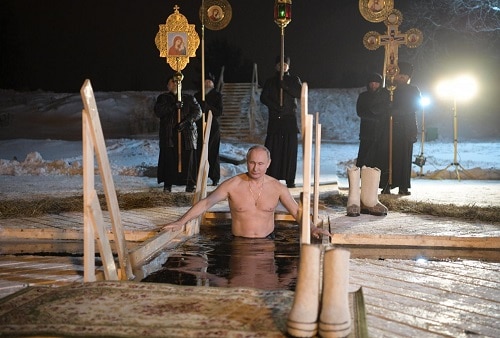 Shirtless Vladimir Putin takes dip in icy Russian lake Shirtless Vladimir Putin takes a dip in freezing Russian lake to celebrate Epiphany. See pictures