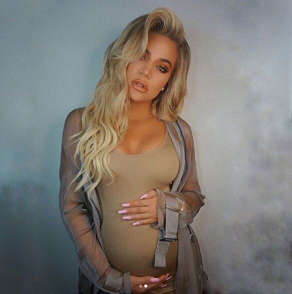 Khloé Kardashian flaunts baby bump