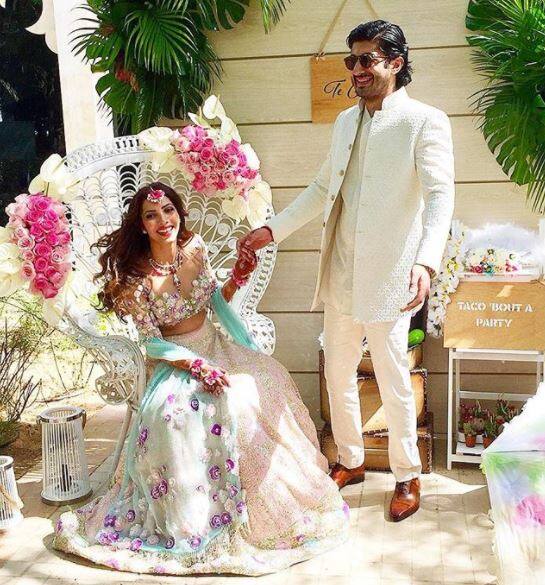 Mohit Marwah captured in a candid moment with Antra Motiwala at their Mehendi. Image: Instagram (@manishmalhotra) 