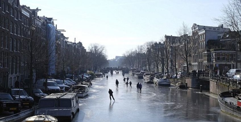 Yes, It Really Happened! People In Amsterdam Are Ice Skating On Frozen Canals