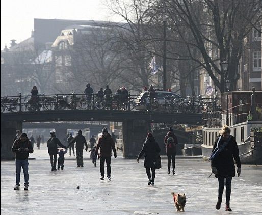 Yes, It Really Happened! People In Amsterdam Are Ice Skating On Frozen Canals