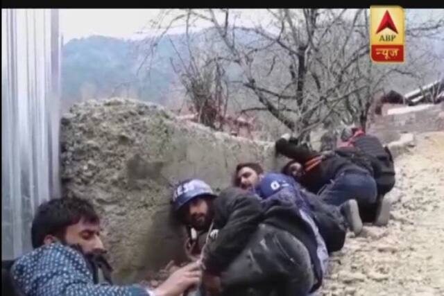 In the exchange of fire between militants and security forces, media persons were seen ducking behind a wall to save themselves.