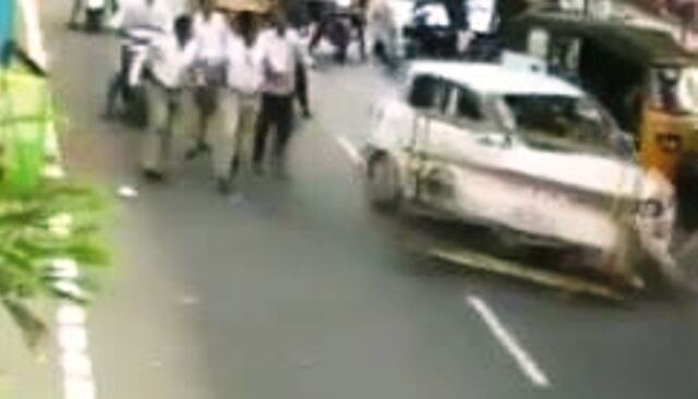  WATCH: Youth stopped for checking by policemen at checkpoint in Kakinada, tried to escape after running over them WATCH: Youth stopped for checking by policemen at checkpoint in Kakinada, tried to escape after 'running over them'