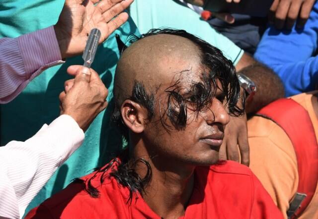 They also want a stay over the conduct of other papers. (AFP PHOTO / MONEY SHARMA)