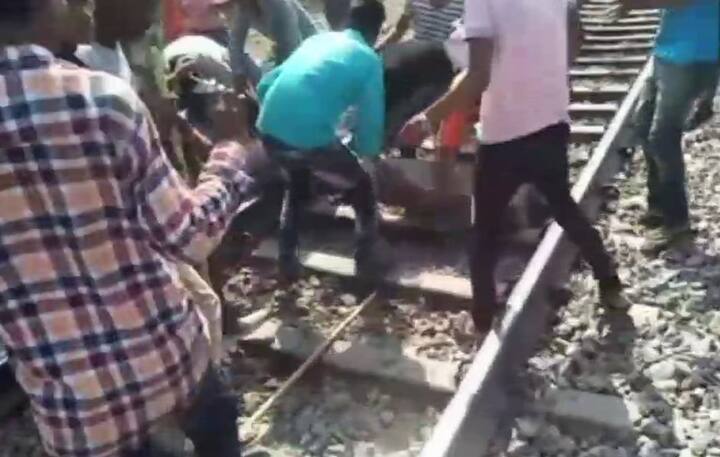 Railway track blocked by violent protesters observing bharat bandh over SC, ST rights/ ANI image