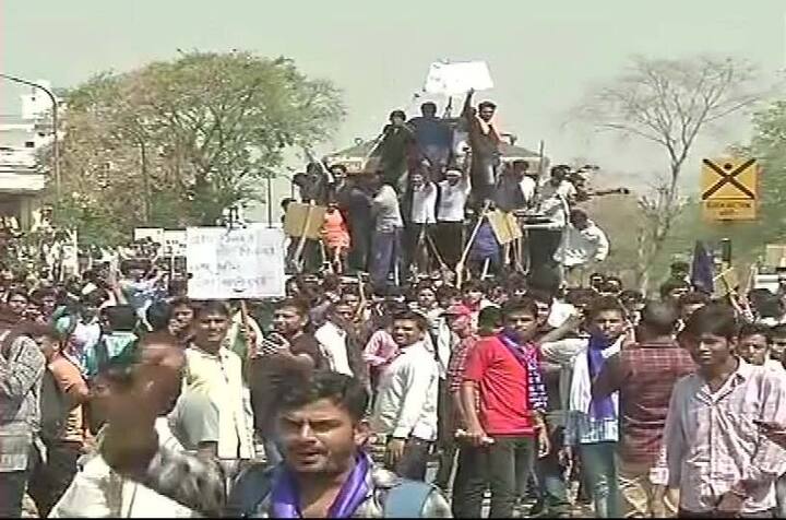 Protesters climb trains and block its way in Jaipur/ ANI image