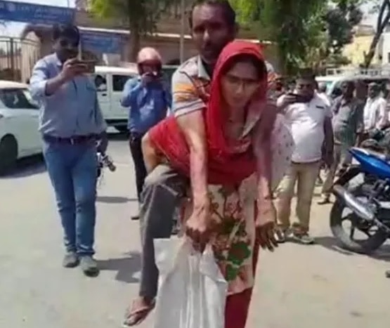 Handicapped man gets aid after video of wife carrying him goes viral Handicapped man gets aid after video of wife carrying him goes viral