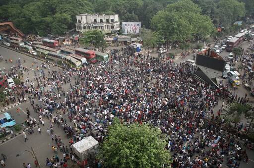 After the crackdown, the students got into clash with police, in which at least a hundred were injured. The clash started on late Sunday and lasted till early Monday , converting Dhaka university into a battleground. /Image: AFP PHOTO / 