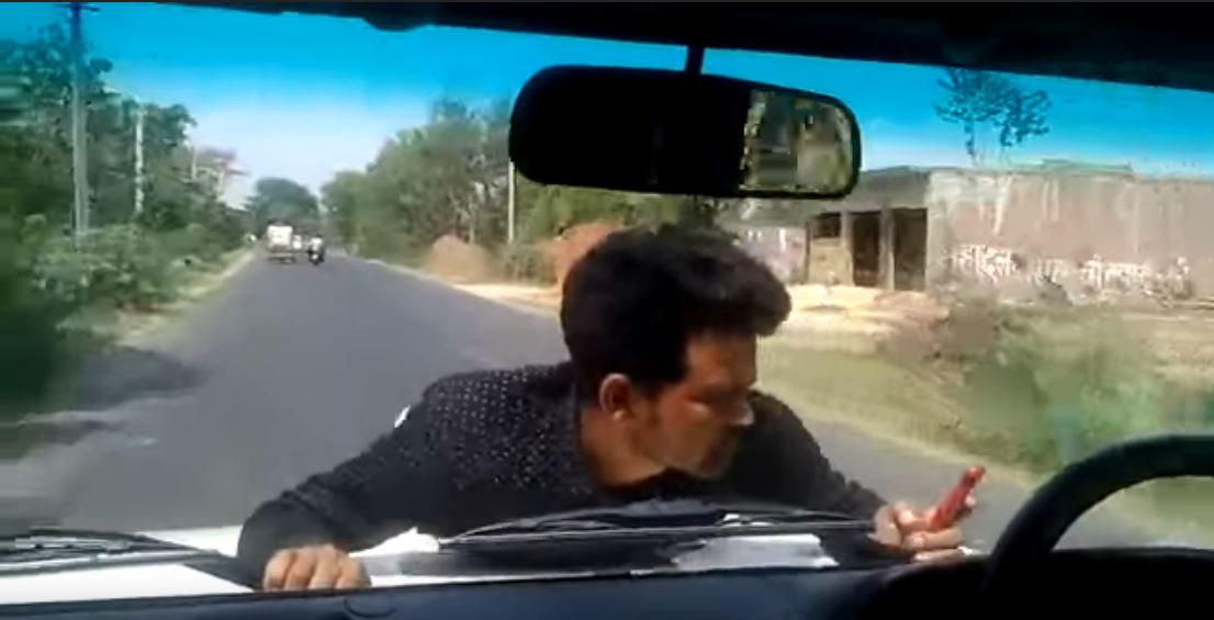 Watch Video: Man clings to UP official’s car bonnet for 4 km