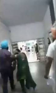 VIDEO: Doctor beats woman in hospital while policemen stand and watch