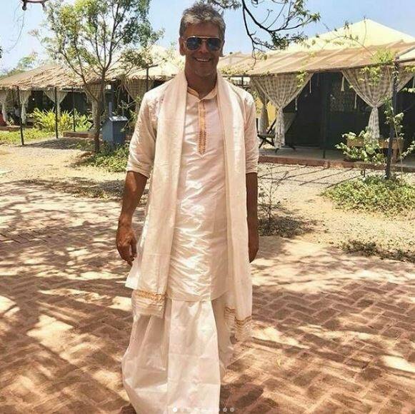 Milind Soman opted for white kurta and dhoti.