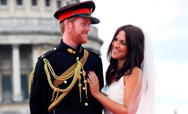 Prince Harry, sixth in line to the British throne, and US actress Meghan Markle sealed their wedding vows with a kiss outside Windsor Castle's St. George's Chapel on Saturday, cheered on by thousands of delighted crowds. (Photo: AP)
