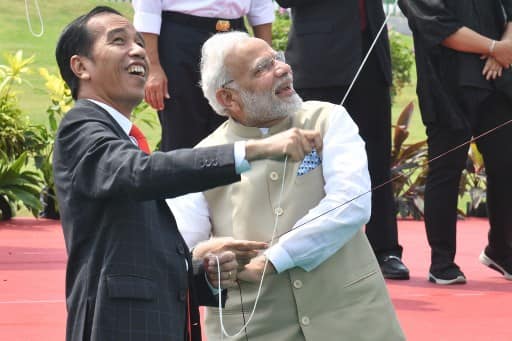 Prime Minister Narendra Modi and Indonesian President Joko Widodo flew kites as they inaugurated the first joint kite exhibition ./ AFP PHOTO / Goh Chai Hin