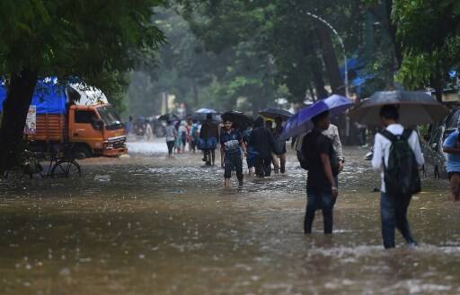 An official said Central Railway suburban services were delayed because of water-logging on tracks between Matunga and Sion. (IMAGE: AFP)