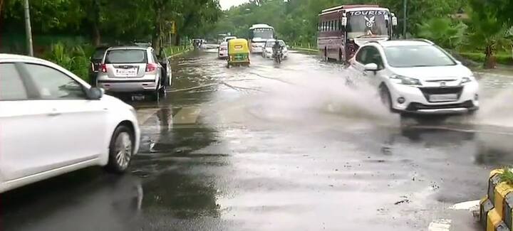 Vehicles splash rain water collected on the roads in Pant Marg/ image: ANI