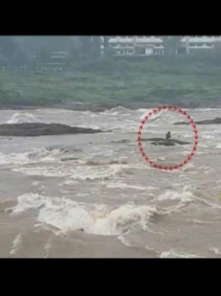 Heavy rainfall lashed Gujarat due to which Damanganga river crossed danger border. Amid this, a man got stuck in Valsad's Damanganga river. He was later rescued by the rescue team. (Video grab: ABP Live)