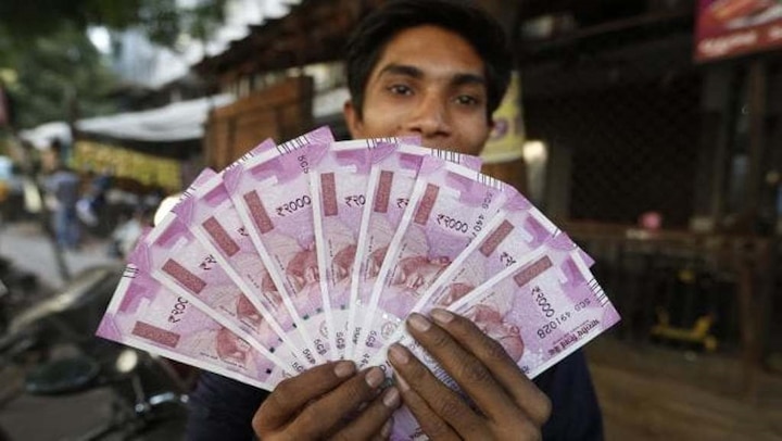 Rupee may hit 70 mark this week, say bankers Rupee may hit 70 mark this week, say bankers