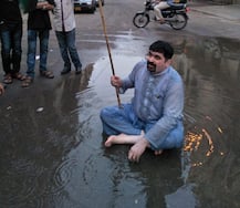 Bizarre! After posing in sewage water, this Pakistani politician gets in gutter and garbage to ask for votes