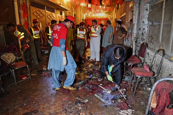 Suicide bombing at an election rally rocks Peshawar, kills 13, including a prominent local politician on Tuesday / AFP
