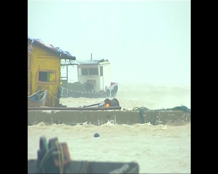 Rough waves washed away some seaside infrastructure onto roads in Fujian's Sansha Town. Image Courtesy: AP