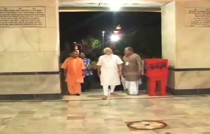 In a late night tour, Prime Minister Narendra Modi reviewed the ongoing development projects in his parliamentary constituency of Varanasi. As Prime Minister Narendra Modi's convoy travelled across his Lok Sabha constituency Varanasi late Saturday night, his supporters gathered in number to see his glimpse. (ANI)