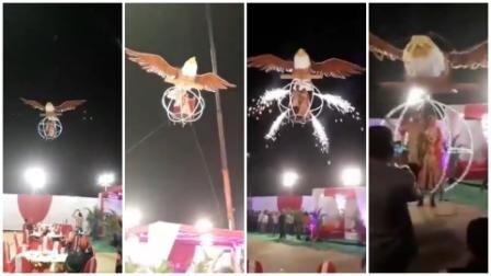 VIDEO: Bride-Groom enter for wedding ceremony in flying-bird-cage VIDEO: Bride-Groom enter wedding ceremony in flying-bird-cage